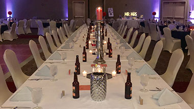 A family-style table setup for a wedding reception at Hollywood Casino St. Louis.