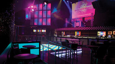 The light-up dance floor and walls and bar inside Boogie Nights night club at Hollywood Casino in St. Louis, Missouri.