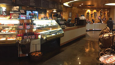 Bakery cases displaying treats next to the counter at Hollywood and Grind inside Hollywood Casino in St. Louis, Missouri.