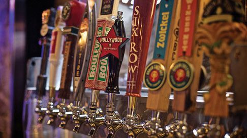 Beer tap handles lined up at the 99 Hops House bar at Hollywood Casino in St. Louis, Missouri.