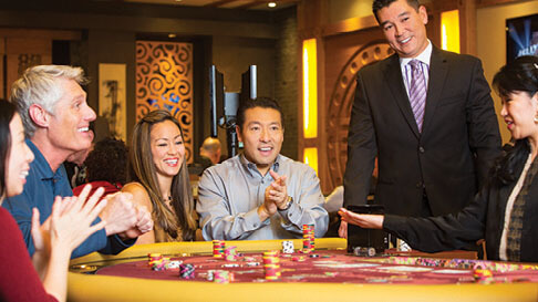 Players cheer a win in the Phat Tai gaming room at Hollywood Casino in St. Louis, Missouri.