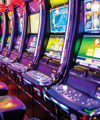 A row of seats in front of slot machines inside Hollywood Casino in St. Louis, Missouri.